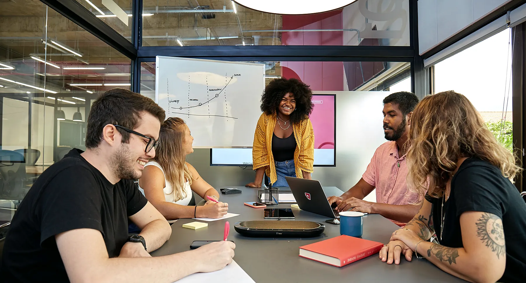 Colleagues in discussion around a meeting table