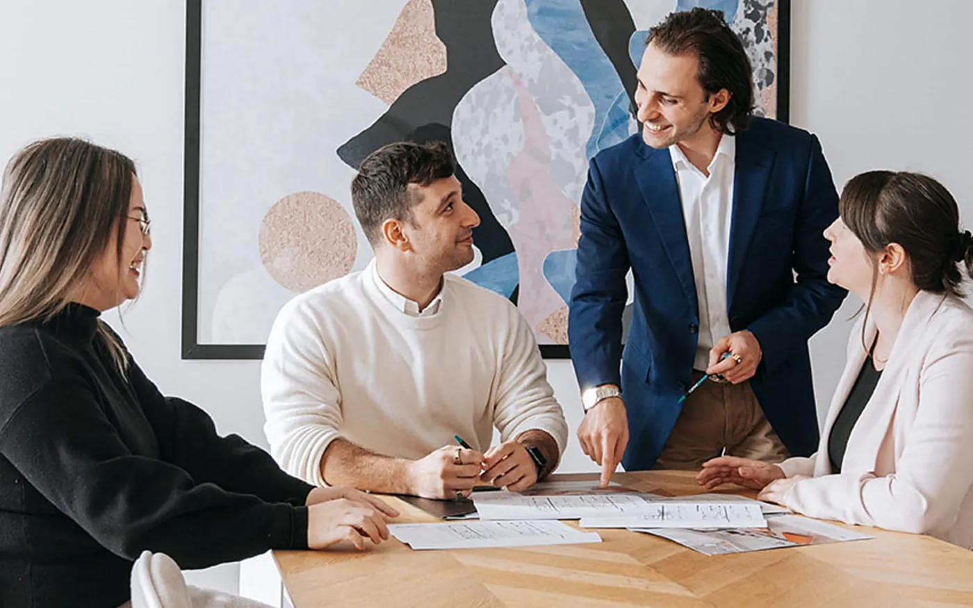 A team reviewing documents together around a conference table